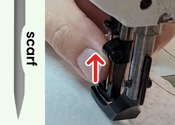 5. Put the needle all the way up inside the needle bar